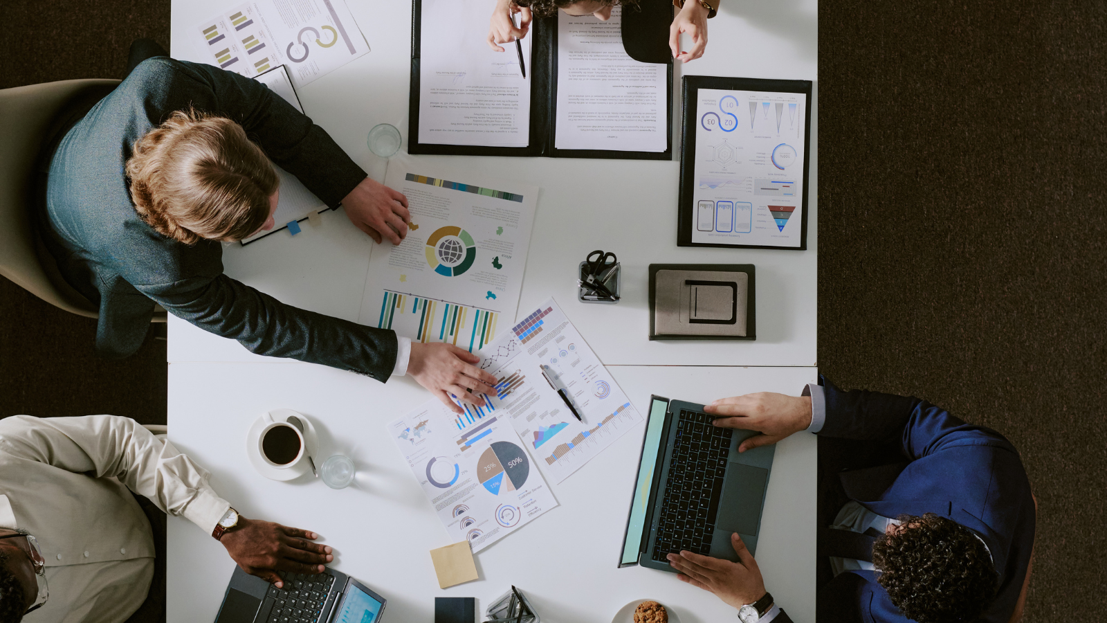 cross functional ecommerce team reviewing workflow and performance reports