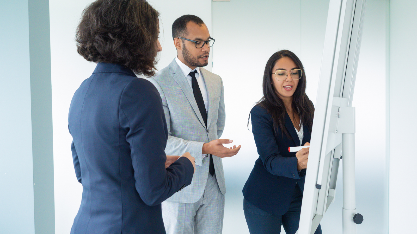 team discussing pricing strategy and customer perception in business meeting