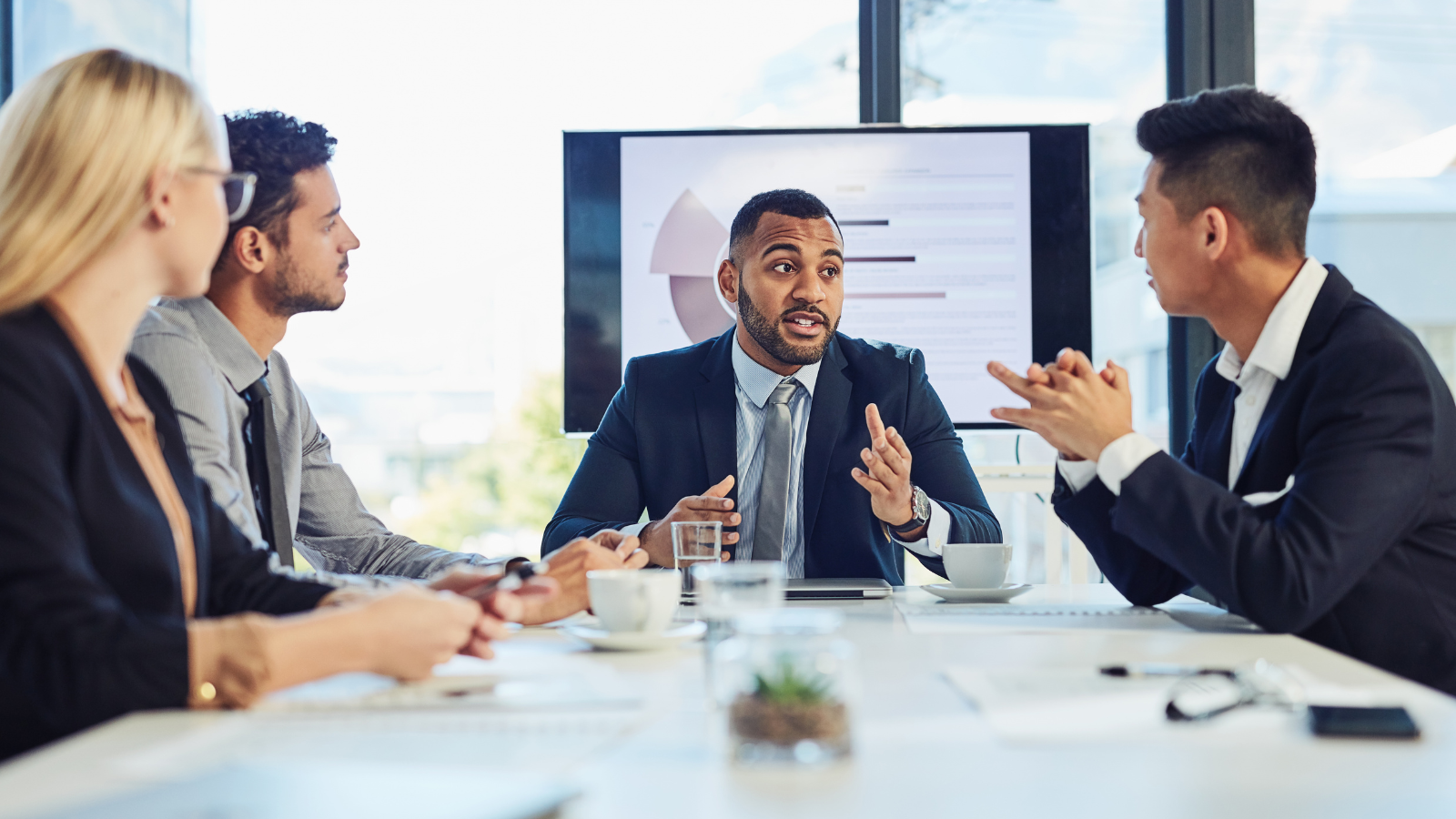 team discussing brand marketing strategy in a business meeting