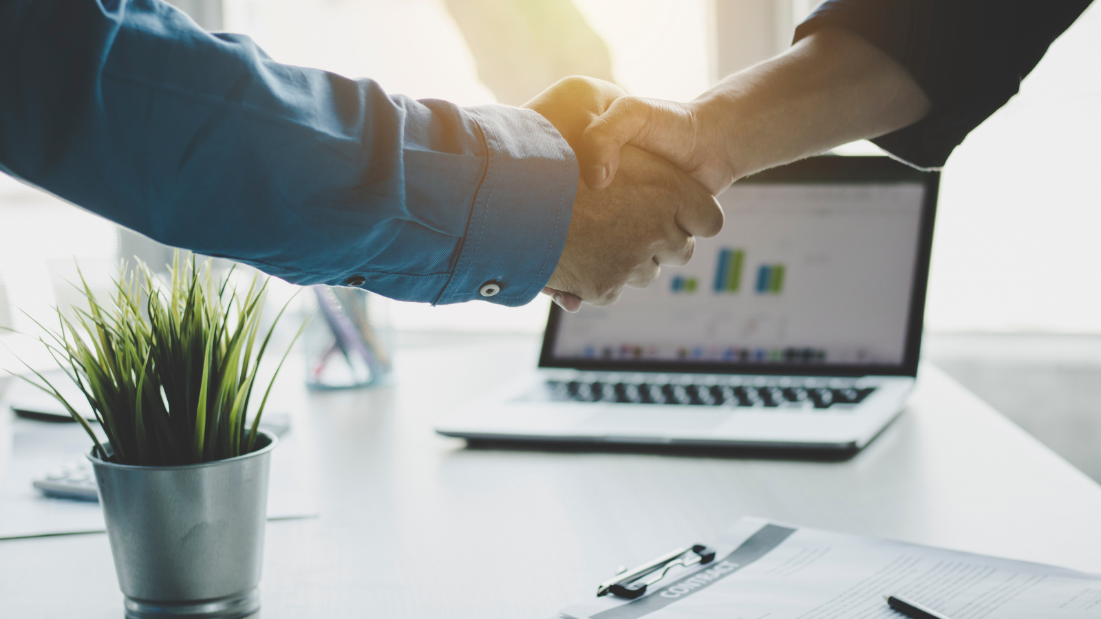 business handshake image representing d2c aggregator partnership and onboarding process