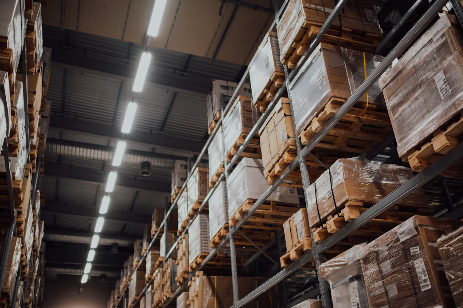 Tall pallet racking in a stocked warehouse aisle