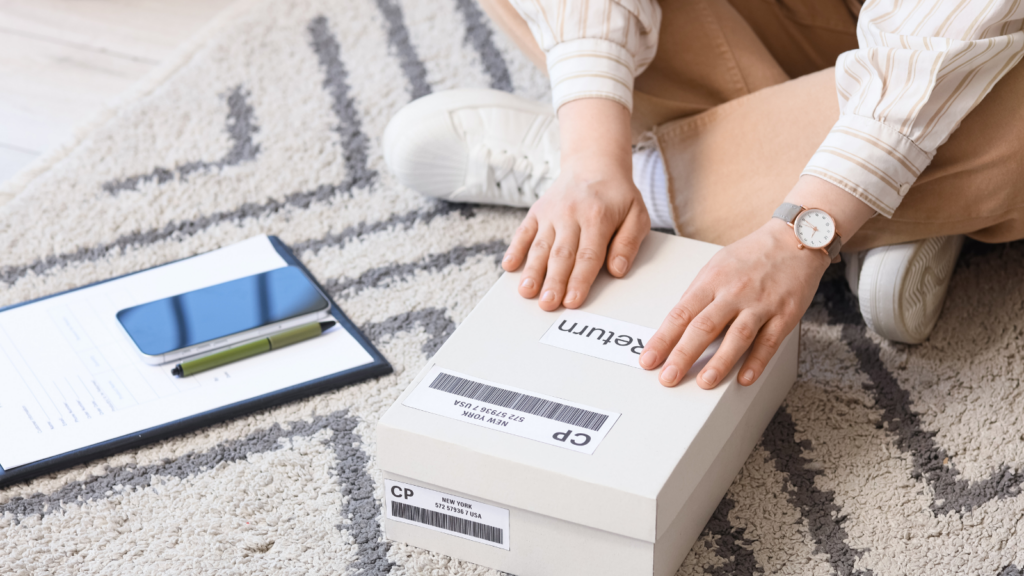 Customer preparing a fashion return package, reflecting return patterns used to audit Myntra catalog accuracy