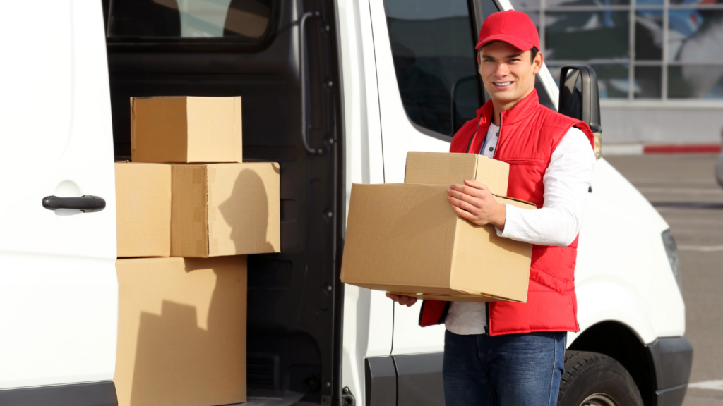 Delivery executive handling ecommerce parcels for last-mile order fulfilment