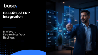 Benefits of ERP Integration: 8 Ways It Streamlines Your Business - Base.com blog cover image showing a business owner interacting with a holographic ERP dashboard