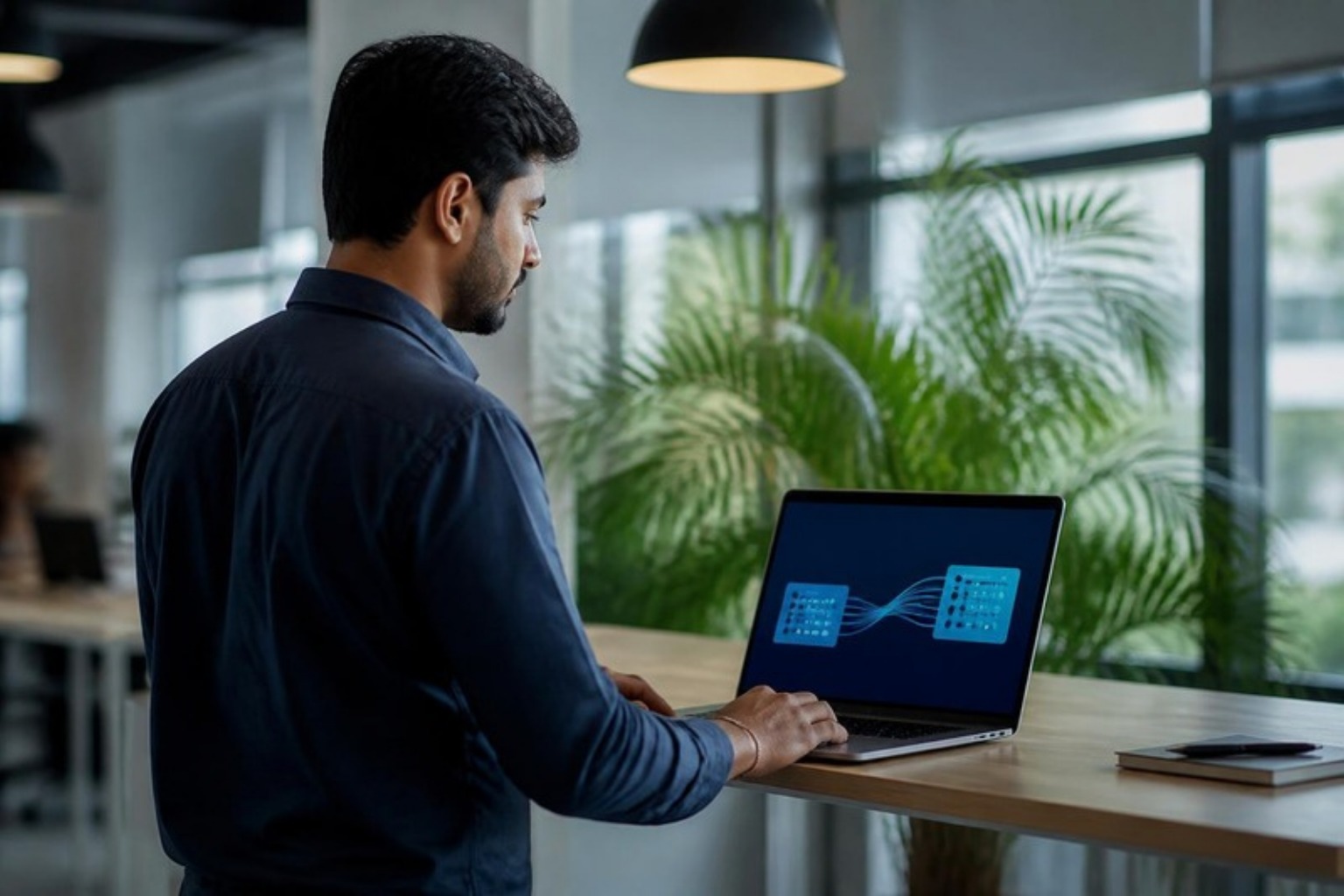 Operations team member connecting an ERP system to sales channels on a laptop