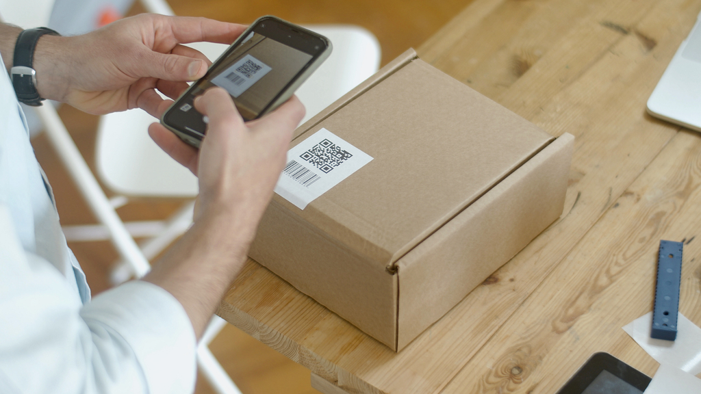 Barcode and QR code scanning showing package verification for accurate ecommerce receiving, picking, packing, and dispatch
