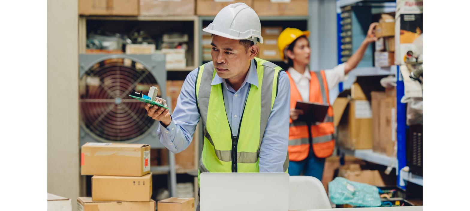 Warehouse worker managing ecommerce inventory and returns using digital tools in a fulfillment facility