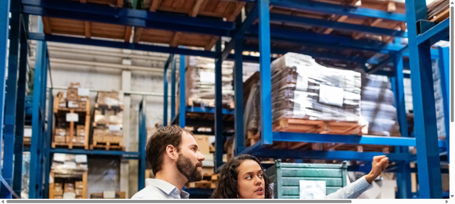 Warehouse operations scene showing teams managing inventory and supply chain activities across a storage facility