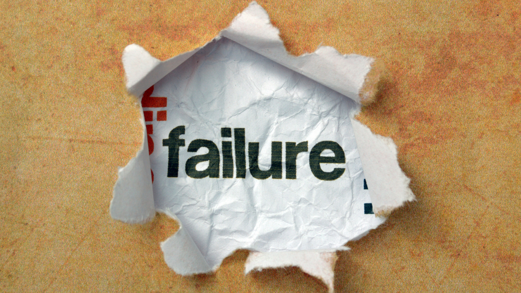 Torn paper with the word “failure,” representing common problems in multi-warehouse inventory operations.
