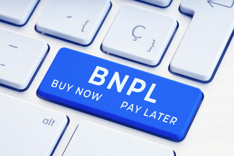Bnpl or buy now pay later message on blue computer keyboard key